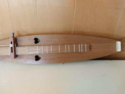 TWO WOODEN MUSICAL INSTRUMENTS