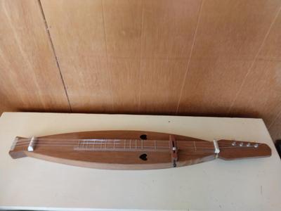 TWO WOODEN MUSICAL INSTRUMENTS