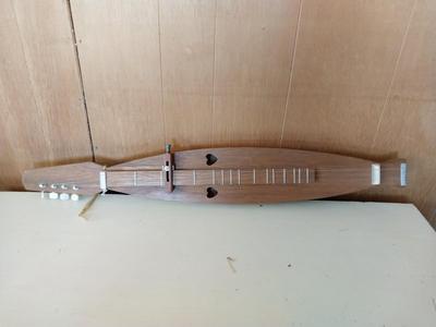 TWO WOODEN MUSICAL INSTRUMENTS