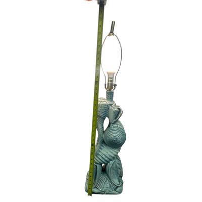 Sale Photo Thumbnail #184: Beach Shells Turquoise Heavy Tall Lamp; Testing/Working (no shade), very unique!
Is not made of concrete but some very heavy substance. 34" tall (entire height), 23" base height