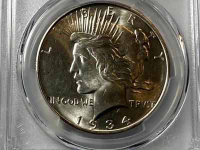PCGS CERTIFIED 1934-D MS63 PEACE SILVER DOLLAR SEMI-KEY DATE AS PICTURED.