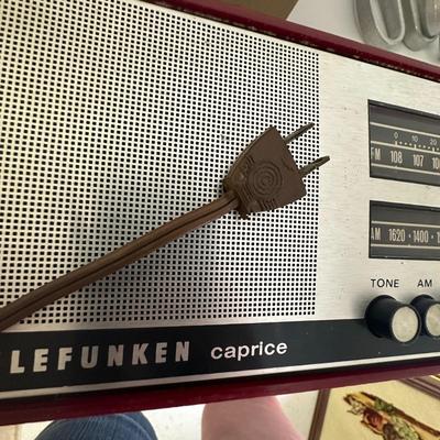 Sale Photo Thumbnail #282: Vintage Working Telefunken (West Germany) Caprice Transistor (Portable Solid-State) Radio, Mid Century Modern
Shows wear but works- tested and it plays both AM and FM; one knob missing