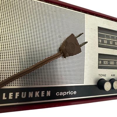 Sale Photo Thumbnail #279: Vintage Working Telefunken (West Germany) Caprice Transistor (Portable Solid-State) Radio, Mid Century Modern
Shows wear but works- tested and it plays both AM and FM; one knob missing