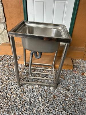 Sale Photo Thumbnail #292: Freestanding 304 Stainless Steel Utility Sink with Stand, Unused
Deep single basin; mounted on a sturdy tubular steel stand with shelf bar at the bottom. Comes with drain assembly and flixible P-trap hose. Never been installed. Great for garage, workshop,