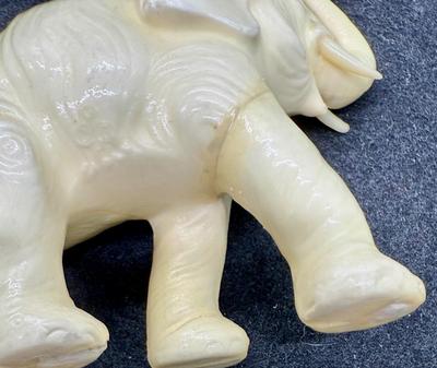 Sale Photo Thumbnail #479: One elephant has a repaired leg.