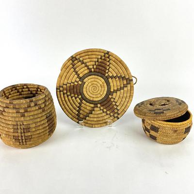 Sale Photo Thumbnail #1265: One basket has lid, other has large weaved coaster
Large basket: 5.75" high
Coaster: 7.75" diameter
Small basket: 4" high with lid