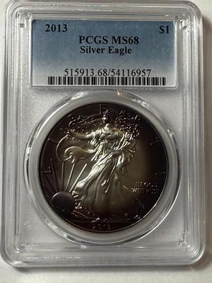PCGS CERTIFIED 2013 MS68 HEAVILY TONED RIMS OBV. SILVER EAGLE DOLLAR AS PICTURED.