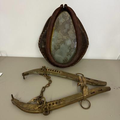 Sale Photo Thumbnail #383: Vtg Horse Collar with mirror insert and Wooden Yoke/Hames with Chains and Rings Set- fair condition; common from mid 1800's to early 20th century. Both pieces show age, wear, and patina consistent with antique farm equipment.