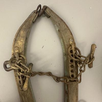 Sale Photo Thumbnail #371: Vtg Horse Collar with mirror insert and Wooden Yoke/Hames with Chains and Rings Set- fair condition; common from mid 1800's to early 20th century. Both pieces show age, wear, and patina consistent with antique farm equipment.