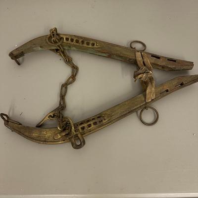 Sale Photo Thumbnail #384: Vtg Horse Collar with mirror insert and Wooden Yoke/Hames with Chains and Rings Set- fair condition; common from mid 1800's to early 20th century. Both pieces show age, wear, and patina consistent with antique farm equipment.