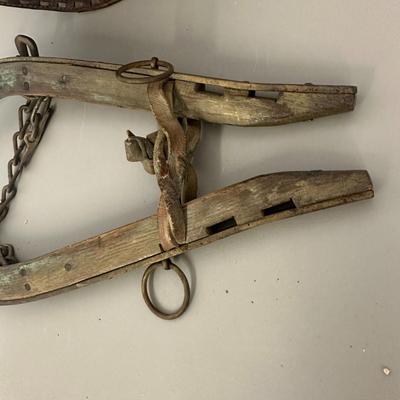 Sale Photo Thumbnail #379: Vtg Horse Collar with mirror insert and Wooden Yoke/Hames with Chains and Rings Set- fair condition; common from mid 1800's to early 20th century. Both pieces show age, wear, and patina consistent with antique farm equipment.