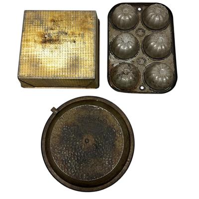 Sale Photo Thumbnail #412: Lot of 3 Vintage Metal Bakeware Baking Pieces
Bake-Rite Square Cake Pan, Bake King round cake pan with rotating insert, and 6 Cup Muffin/Cupcake Mold. All show age and patina consistent with vintage use.