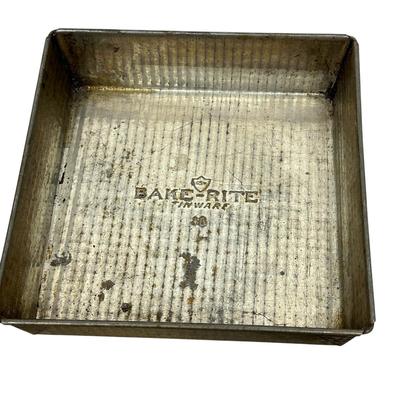 Sale Photo Thumbnail #414: Lot of 3 Vintage Metal Bakeware Baking Pieces
Bake-Rite Square Cake Pan, Bake King round cake pan with rotating insert, and 6 Cup Muffin/Cupcake Mold. All show age and patina consistent with vintage use.