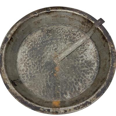 Sale Photo Thumbnail #413: Lot of 3 Vintage Metal Bakeware Baking Pieces
Bake-Rite Square Cake Pan, Bake King round cake pan with rotating insert, and 6 Cup Muffin/Cupcake Mold. All show age and patina consistent with vintage use.