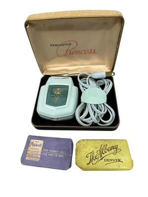 Sale Photo Thumbnail #416: Remington Princess Razor & 2 Vtg Hotel Soaps
Razor barely makes a sound when plugged in.