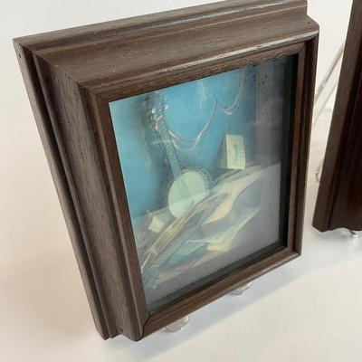 Sale Photo Thumbnail #1329: Framed behind glass, one with banjo art inside glass is more foggy
Both measure: 6.5" wide x 7.5" high