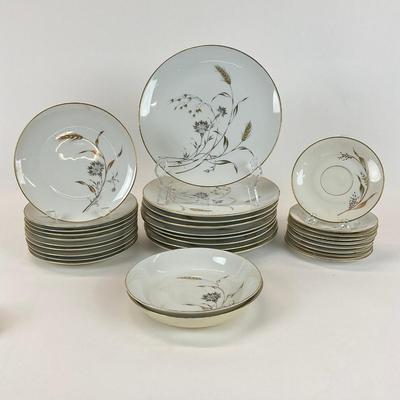 Sale Photo Thumbnail #1338: Big and small oval platter, seven dessert plates, sugar plate, nine dinner plates ten salad plates, nine saucers, two large soup bowls. One bowl is chipped