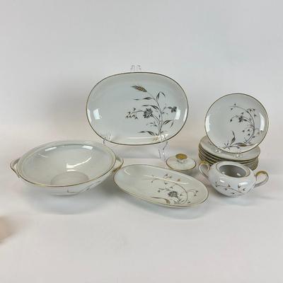 Sale Photo Thumbnail #1339: Big and small oval platter, seven dessert plates, sugar plate, nine dinner plates ten salad plates, nine saucers, two large soup bowls. One bowl is chipped