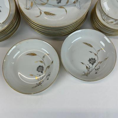 Sale Photo Thumbnail #1342: Big and small oval platter, seven dessert plates, sugar plate, nine dinner plates ten salad plates, nine saucers, two large soup bowls. One bowl is chipped