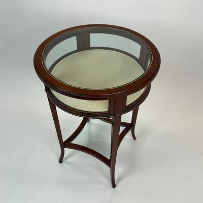 Sale Photo Thumbnail #1388: One side hinged top, has removable bottom glass insert, has brass/gold metal hardware
Measures: 19.5" diameter x 27.5" high