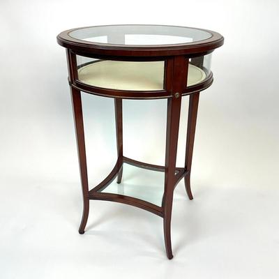 Sale Photo Thumbnail #1384: One side hinged top, has removable bottom glass insert, has brass/gold metal hardware
Measures: 19.5" diameter x 27.5" high