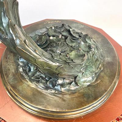 Sale Photo Thumbnail #1403: Against the Wind is an elegant rendition of a pair of mallards cutting through the wind for a landing .  The design incorporates beautiful "S" curves and circular motion rising out of an integrated formal bronze base.  This piece is suitable for indoor, o