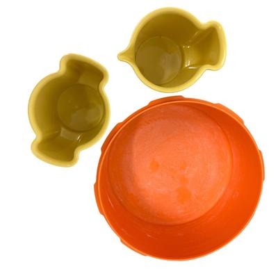 Sale Photo Thumbnail #465: Tupperware Lot of 3 Plus 2 Vtg Mugs
-large orange Tupperware container with sunburst lid, 70s design
-2 mustard yellow Tupperware one cup containers with hinged lids
-two matching retro mugs w/ blue base marked Bopp-Decker Plastics Inc, Birmingham Mich., 