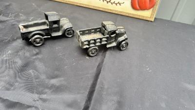 DIE CAST FARMALL TRACTOR, TWO CAST IRON MODEL A TRUCKS AND WALL HANGING