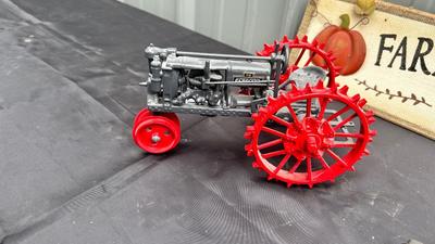 DIE CAST FARMALL TRACTOR, TWO CAST IRON MODEL A TRUCKS AND WALL HANGING