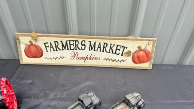 DIE CAST FARMALL TRACTOR, TWO CAST IRON MODEL A TRUCKS AND WALL HANGING