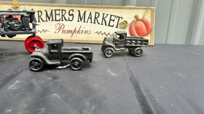 DIE CAST FARMALL TRACTOR, TWO CAST IRON MODEL A TRUCKS AND WALL HANGING