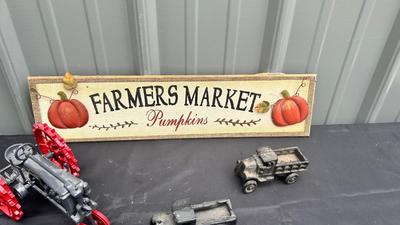 DIE CAST FARMALL TRACTOR, TWO CAST IRON MODEL A TRUCKS AND WALL HANGING