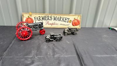 DIE CAST FARMALL TRACTOR, TWO CAST IRON MODEL A TRUCKS AND WALL HANGING