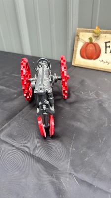 DIE CAST FARMALL TRACTOR, TWO CAST IRON MODEL A TRUCKS AND WALL HANGING