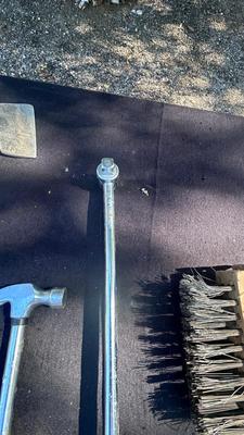 HATCHET, HAMMER, TORQUE WRENCH, SANDER, AND A WIRE BRUSH