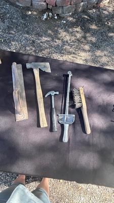 HATCHET, HAMMER, TORQUE WRENCH, SANDER, AND A WIRE BRUSH