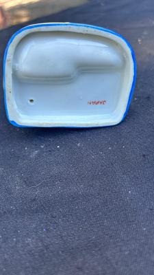 VINTAGE SALT AND PEPPER SHAKERS, TOOTHPICK HOLDERS, AND TIN SIGN