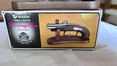 DERRINGER GUN TABLE LIGHTER, DIE-CAST JEEP GRAND CHEROKEE AND SNOWMOBILE AVON BOTTLE