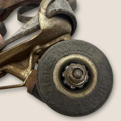 Sale Photo Thumbnail #535: Vintage Adjustable Metal Roller Skates w Leather Straps and Hard Composite Wheels, early 20th Century, patent date Nov. 27, 1917. Visible rust, wear, and aging.