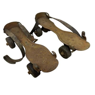 Sale Photo Thumbnail #541: Vintage Adjustable Metal Roller Skates w Leather Straps and Hard Composite Wheels, early 20th Century, patent date Nov. 27, 1917. Visible rust, wear, and aging.