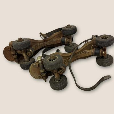 Sale Photo Thumbnail #534: Vintage Adjustable Metal Roller Skates w Leather Straps and Hard Composite Wheels, early 20th Century, patent date Nov. 27, 1917. Visible rust, wear, and aging.