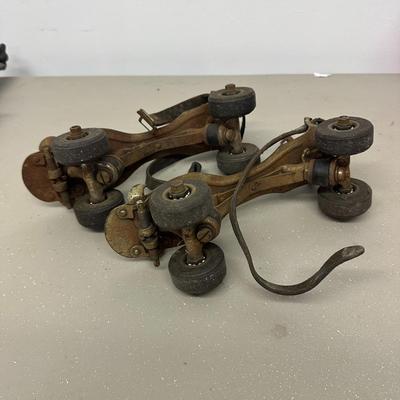 Sale Photo Thumbnail #536: Vintage Adjustable Metal Roller Skates w Leather Straps and Hard Composite Wheels, early 20th Century, patent date Nov. 27, 1917. Visible rust, wear, and aging.