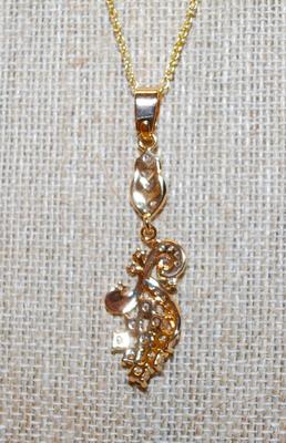 Graphic Designed Flowery PENDANT (2" x ¾") with 10 Larger Round Clear Stones on a Gold Tone Necklace Chain 18" L