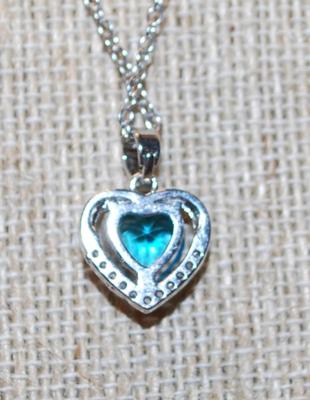 Pretty Heart Shaped Blue Faceted Stone Inside a 10 Clear Stone Silver Heart PENDANT ( ½" x ½") on a Silver Tone Necklace Chain...