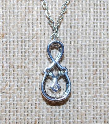 Figure 8 Style Glitter PENDANT (¾" x ½") on a Silver Tone Necklace Chain 17" L
