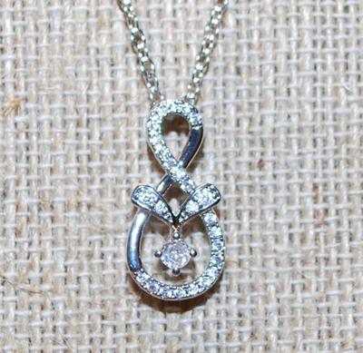 Figure 8 Style Glitter PENDANT (¾" x ½") on a Silver Tone Necklace Chain 17" L
