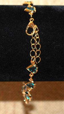 12 Blue Hearts Bracelet with Gold Tone Surrounds & Chain 7" Circumference