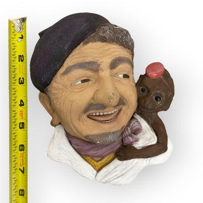Sale Photo Thumbnail #732: Ceramic Organ Grinder Face with Monkey, approx. 8" 
no branding, no idea of age, there is a place to hang on back