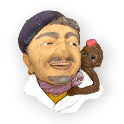 Sale Photo Thumbnail #728: Ceramic Organ Grinder Face with Monkey, approx. 8" 
no branding, no idea of age, there is a place to hang on back