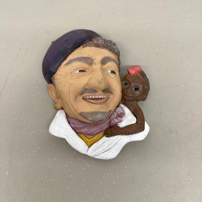 Sale Photo Thumbnail #733: Ceramic Organ Grinder Face with Monkey, approx. 8" 
no branding, no idea of age, there is a place to hang on back